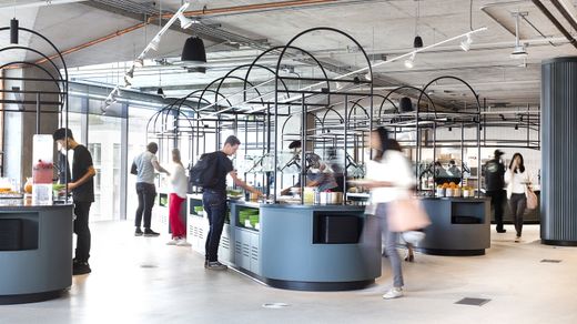 Market-style food hall with arched serving stations