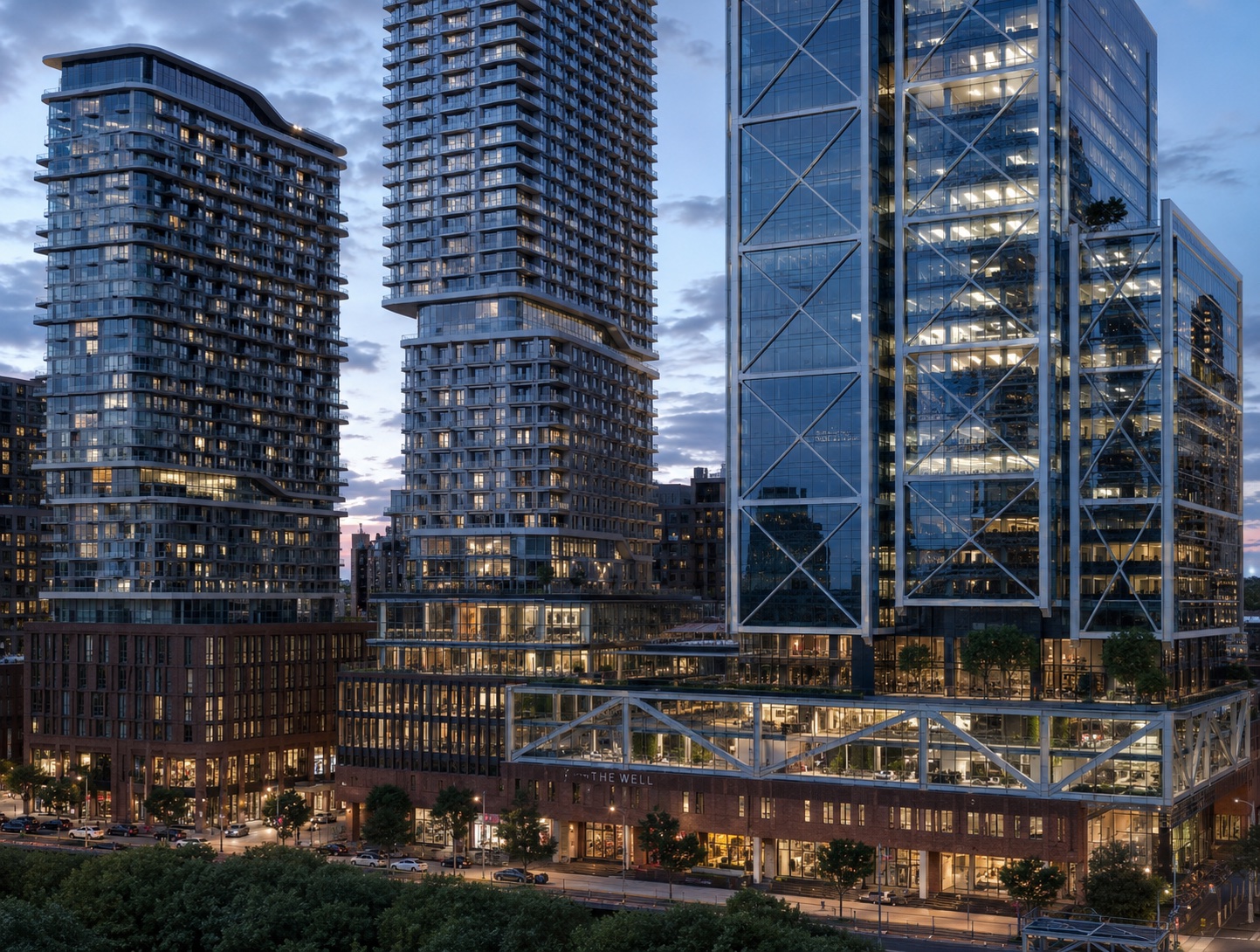 The Well, Toronto — Shopify's flagship campus: glass towers over a multi-level atrium base at dusk